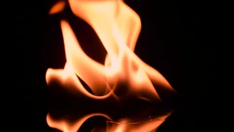Fire and flames burning, in slow motion with a black background Stock Footage 78653848
