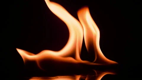 Fire and flames burning, in slow motion with a black background Stock Footage 78653931