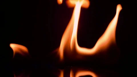 Fire and flames burning, in slow motion with a black background Stock Footage 78654652