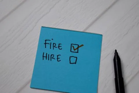 Fire and Hire write on a sticky note. Supported by an additional services Stock Photos