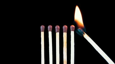 Fire and matches on a black background Stock Photos