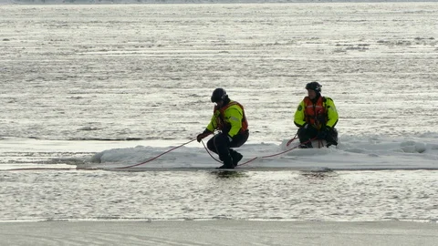 Fire and rescue apprentice on formation at ice and water training operation Stock Footage 88688371