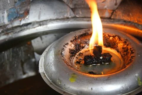Fire and retro lamp. Stock Photos
