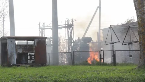 Fire and smoke from burning electrical transformer during summer hot weather. Po Stock-Footage 140924727
