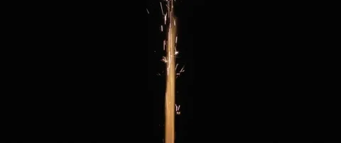 Fire and sparks coming out of a firework, orange and yellow color. Stock Footage 132965026