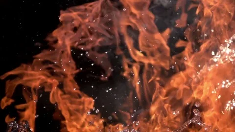 Fire and Water. Slow movement of fire and water. Fire and water collide  Stock Footage 76893810