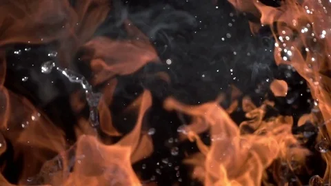 Fire and Water. Slow movement of fire and water. Fire and water collide  Stock Footage 76893812