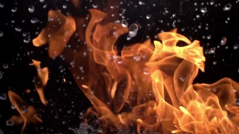 Fire and Water. Slow movement of fire and water. Fire and water collide  Stock Footage 76894003