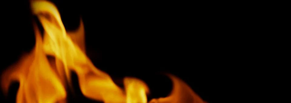 Fire background. Abstract burning flame and black background. Stock Photos