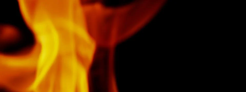 Fire background. Abstract burning flame and black background. Stock Photos