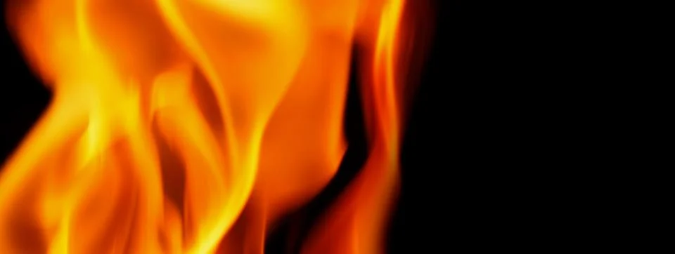 Fire background. Abstract burning flame and black background. Stock Photos