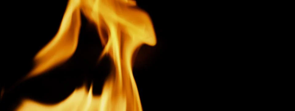 Fire background. Abstract burning flame and black background. Stock Photos