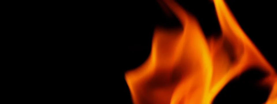 Fire background. Abstract burning flame and black background. Stock Photos
