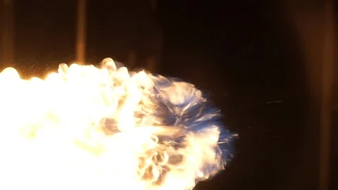 Fire balls soar through the air in slow motion Stock Footage