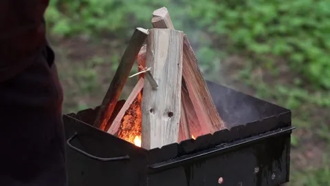 Fire in the barbecue. Firewood is burning Stock Footage 132998960