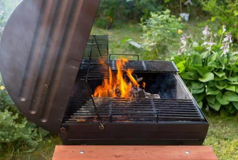 Fire in barbecue grill Stock Photos