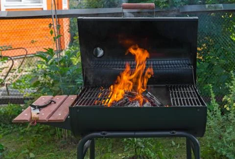 Fire in barbecue grill Stock Photos