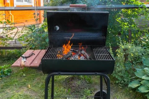Fire in barbecue grill Stock Photos