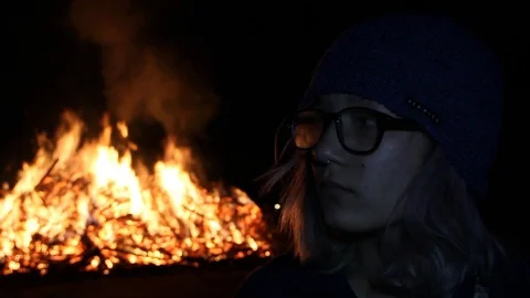 Fire behind close up of a teen Stock Footage 122356232