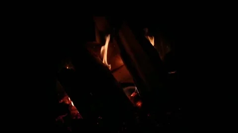 Fire behind cold wood in the fireplace at home Stock Footage 168488472