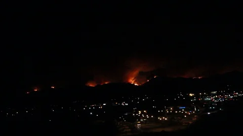 A fire behind a small city Stock Footage 109204740