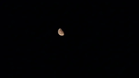 Fire below moon is about to change the moon's color Stock Footage 109207872