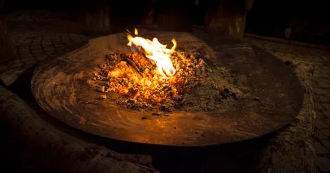 Fire in a big metal shell Stock Photos