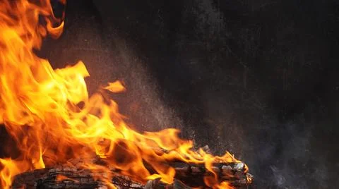 Fire on black background, space for text Stock Photos