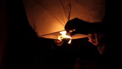 Fire Blazing under a Paper Lantern - Slow Motion Stock Footage 91736870