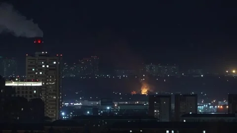 Fire bonfire over the roofs in the night city 動画素材 276742180