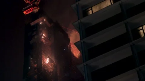 A fire breaks out in a high-rise skyscraper office building under Stock Footage 237049967