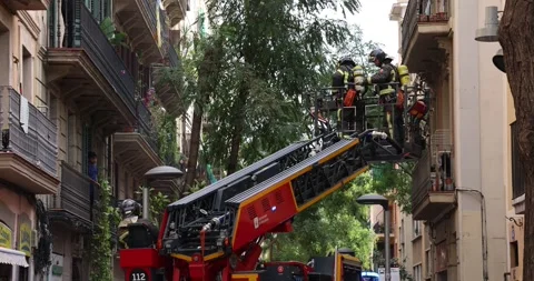 A fire brigade team descending in a aerial platform Stock Footage 321307975