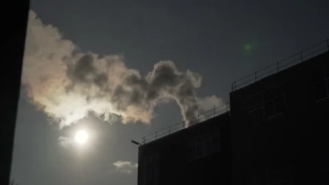 Fire in the building in winter. Smoke comes from the roof Stock Footage 149145899