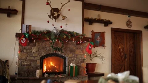 Fire burn in a fireplace decorated with ... | Stock Video | Pond5