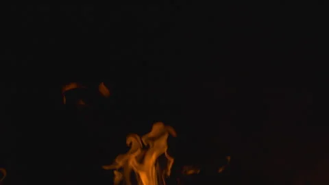 Fire burning and flame glowing on black background Stock Footage 247807731