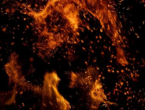 A fire is burning and the smoke is creating a lot of sparks Stock Photos