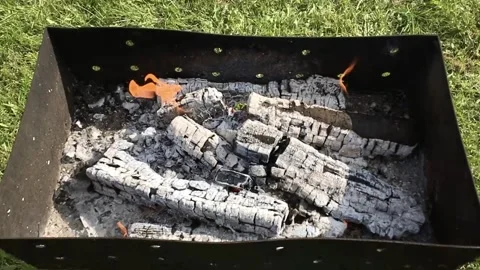 Fire burning for barbecues ready in a metal barbecue.Slow motion. Stock Footage