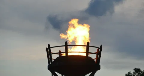Fire burning in a brazier or beacon viewed low angle Video stock 152752159