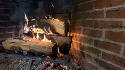 Fire burning in brick fireplace Stock Footage 124509835