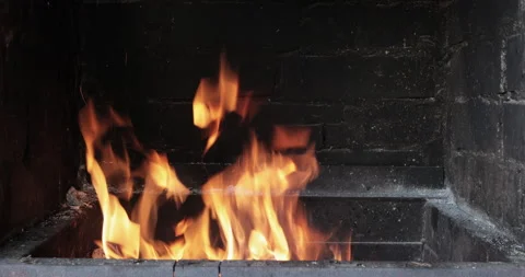 Fire burning in a brick fireplace Video stock 136467850