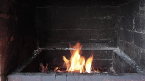 Fire burning in a brick fireplace Video stock 136468021