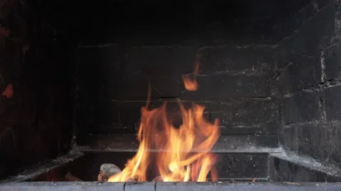 Fire burning in a brick fireplace Stock Footage 136468149