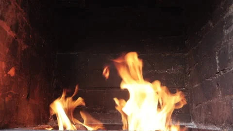 Fire burning in a brick fireplace Video stock 136468524