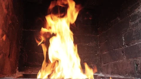 Fire burning in a brick fireplace Video stock 136468656