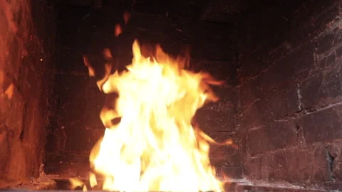 Fire burning in a brick fireplace Video stock 136468761