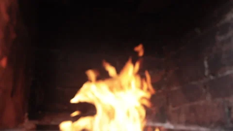 Fire burning in a brick fireplace Video stock 136468908