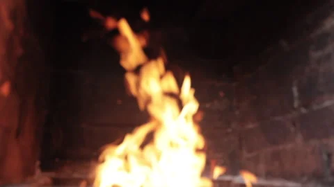 Fire burning in a brick fireplace Video stock 136469080