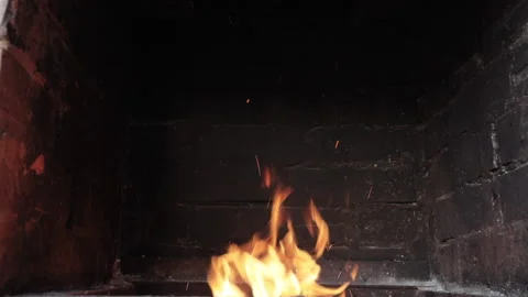 Fire burning in a brick fireplace Video stock 136469250