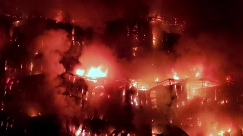 Fire is burning in a building with smoke and flames Stock Footage 332198086