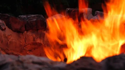 Fire burning in a camp fire pit Stock Footage 77352643